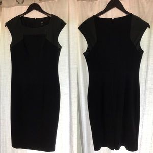Black dress with leather detail. Size 6.